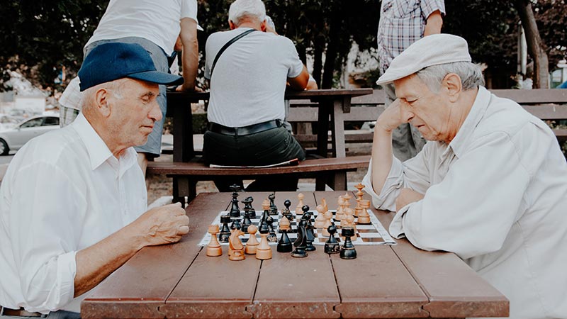 Elders playing chess