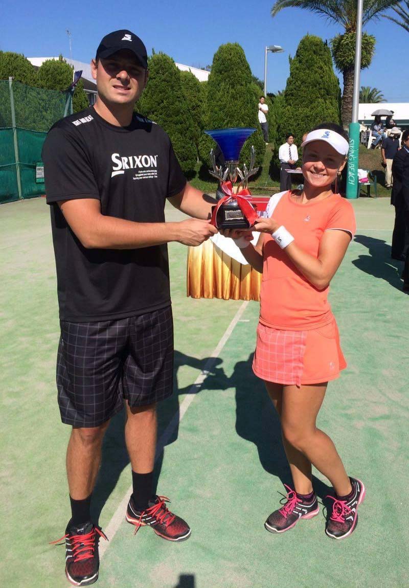 Max and Ksenia holding Trophy cup